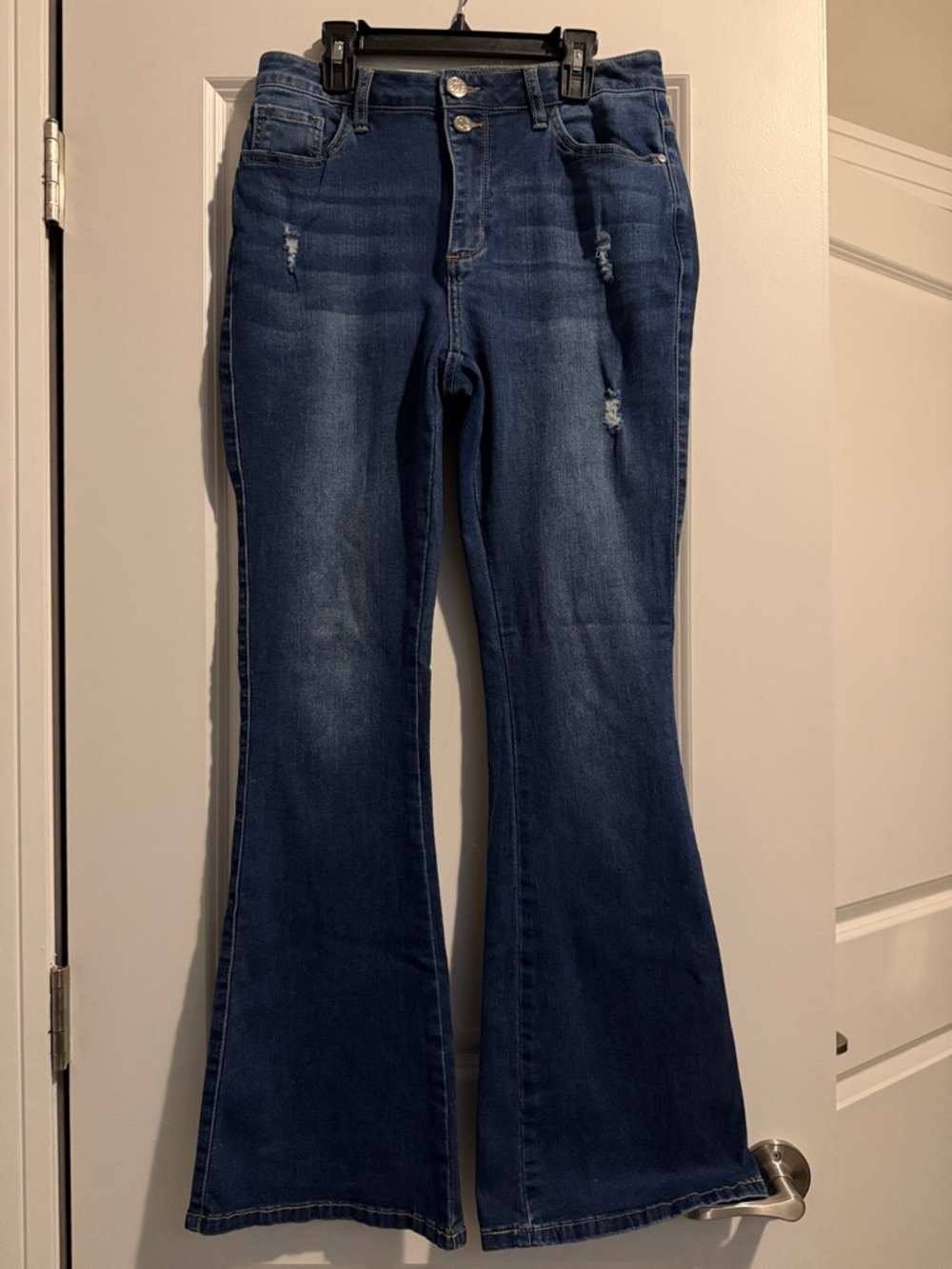 High-Rise Dark Blue Flare Jeans with Subtle Distress